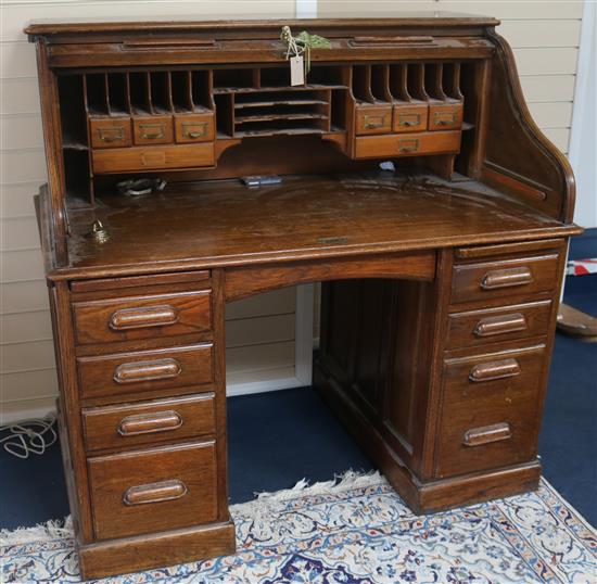 An American oak roll top desk, W.128cm